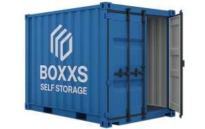 A bright blue 10ft BOXXS Self Storage container with the company logo, shown with one open door revealing a light-grey interior, photographed in studio lighting.