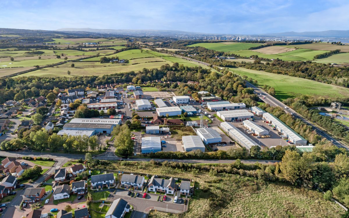 Aerial landscape view of Mill Road Industrial Estate in Linlithgow, West Lothian, Scotland, with surrounding countryside and residential areas.