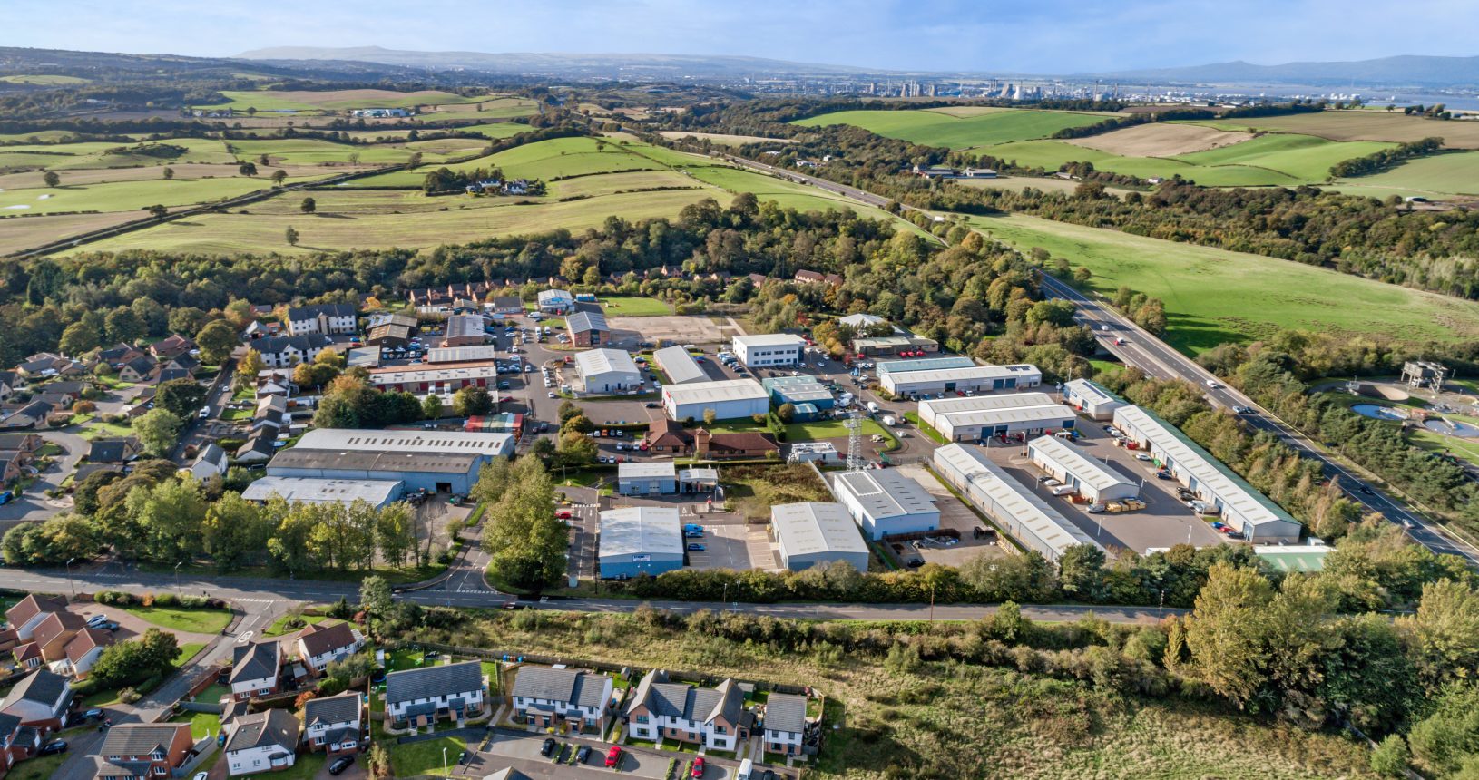 Aerial landscape view of Mill Road Industrial Estate in Linlithgow, West Lothian, Scotland, with surrounding countryside and residential areas.