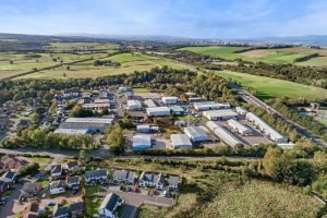Aerial landscape view of Mill Road Industrial Estate in Linlithgow, West Lothian, Scotland, with surrounding countryside and residential areas.