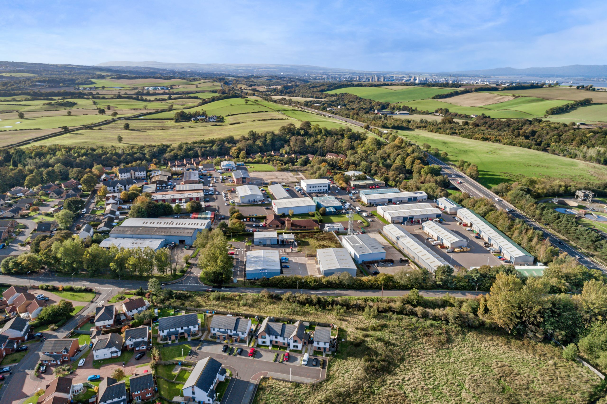 Aerial landscape view of Mill Road Industrial Estate in Linlithgow, West Lothian, Scotland, with surrounding countryside and residential areas.