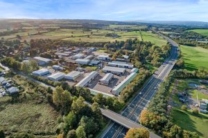 Aerial view of Mill Road Industrial Estate in Linlithgow, West Lothian, Scotland, showing industrial units and surrounding countryside.