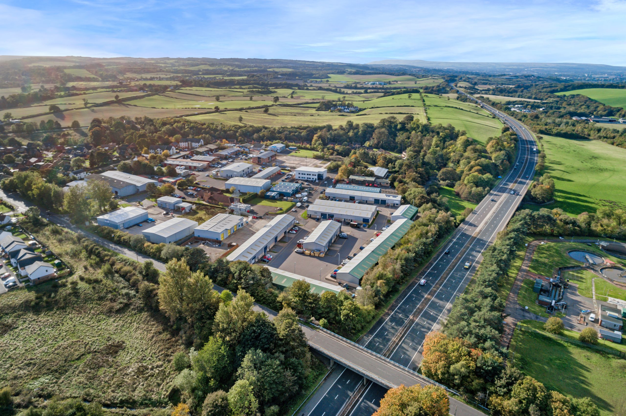 Aerial view of Mill Road Industrial Estate in Linlithgow, West Lothian, Scotland, showing industrial units and surrounding countryside.