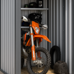 Motorbike securely stored inside a Boxxs Mini Boxx self-storage unit with drive-up access