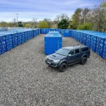 Drive-up-storage-for-businesses containers at Mill Road Industrial Estate in Linlithgow with direct vehicle access and secure outdoor layout