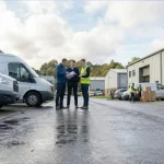 Flexible commercial space at Mill Road Industrial Estate showing business owners reviewing plans outside modern industrial units