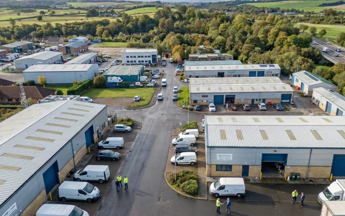 Mill Road Industrial Estate in Linlithgow showing industrial units with vehicle access near motorway routes